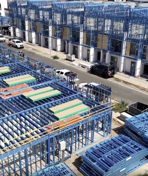 Close view of the blue steel framing of the Wattle House townhomes under construction