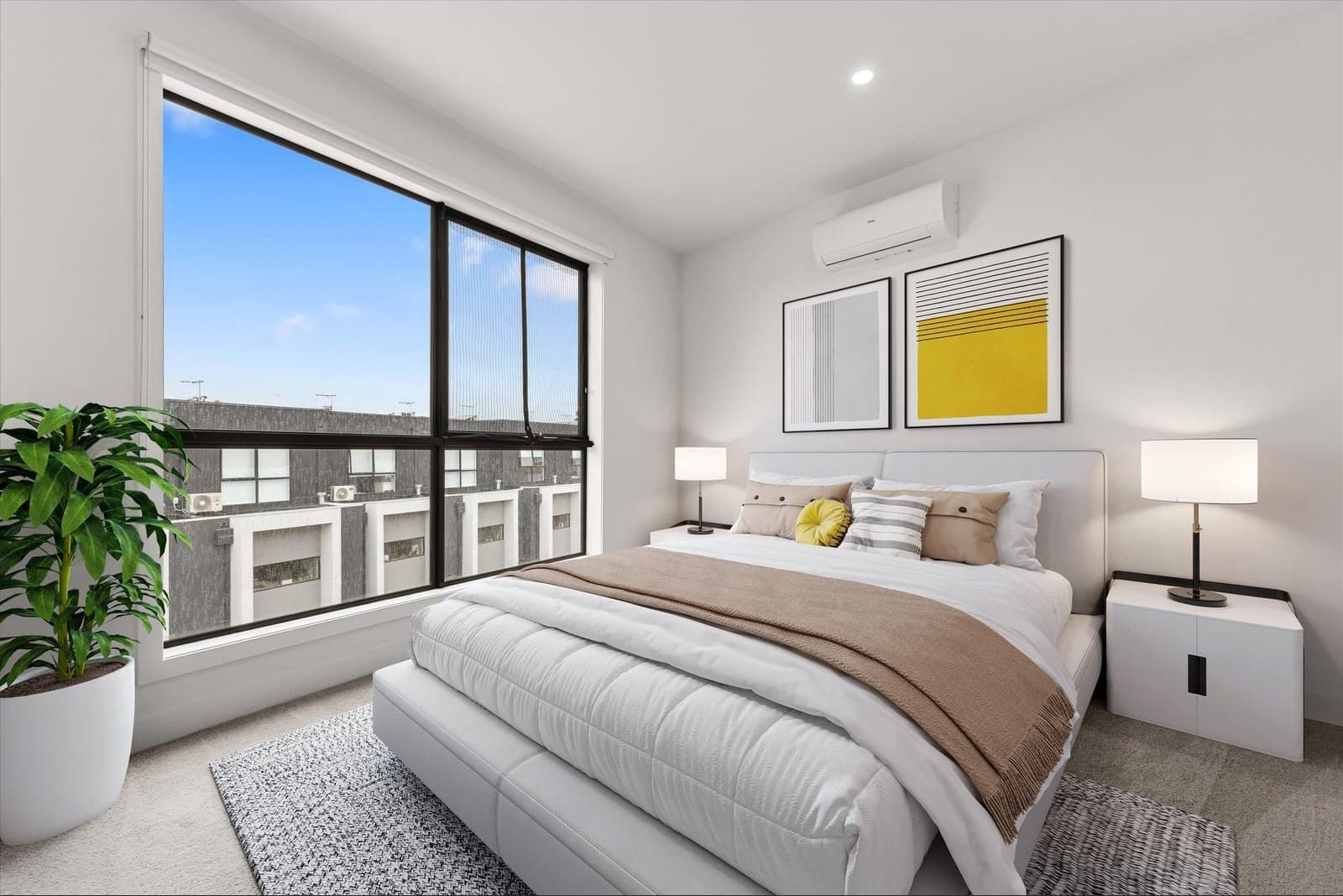 Wall-mounted split-system head installed in a bedroom at the Belmont Collection in Mill Park