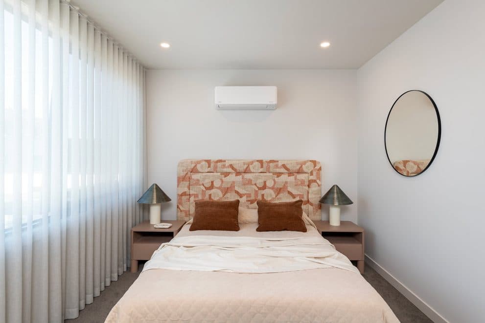 Wall-mounted split-system head above the bed in a bedroom at Early 3191, Sandringham