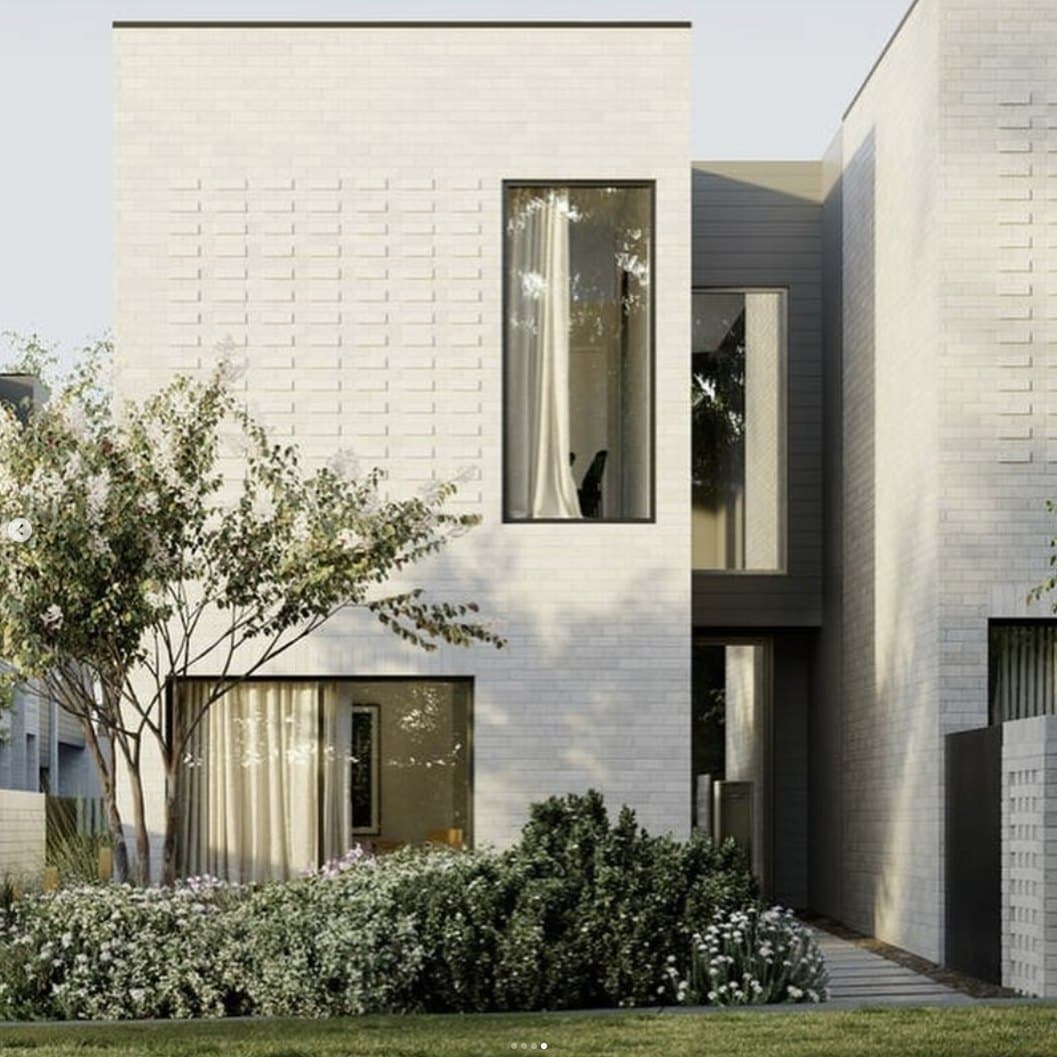 White-brick facade and landscaped frontage of an Early 3191 townhome in Sandringham